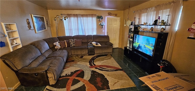 living room featuring dark tile patterned floors