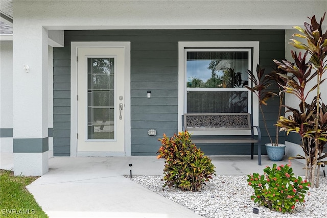 doorway to property featuring covered porch