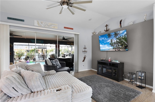 living room featuring lofted ceiling, tile patterned flooring, and ceiling fan