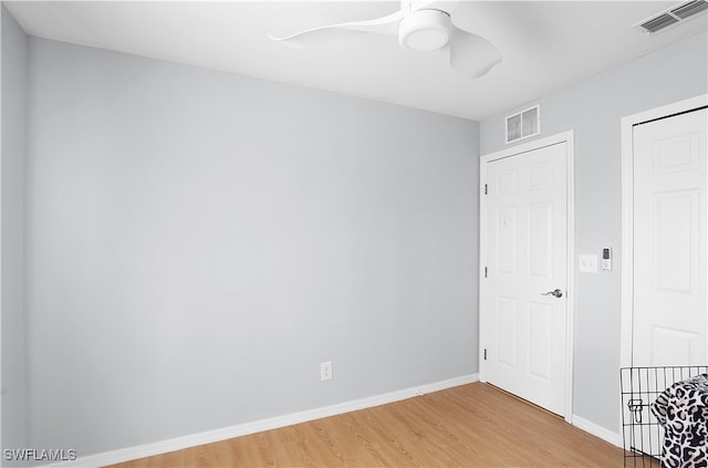 spare room featuring wood-type flooring