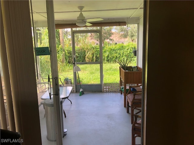 sunroom / solarium with ceiling fan