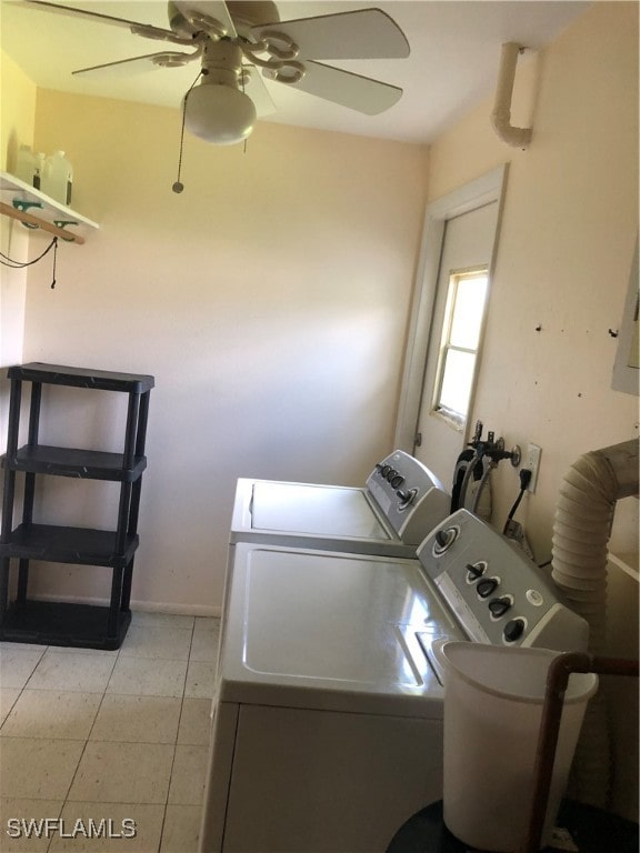 clothes washing area featuring separate washer and dryer, light tile patterned flooring, and ceiling fan