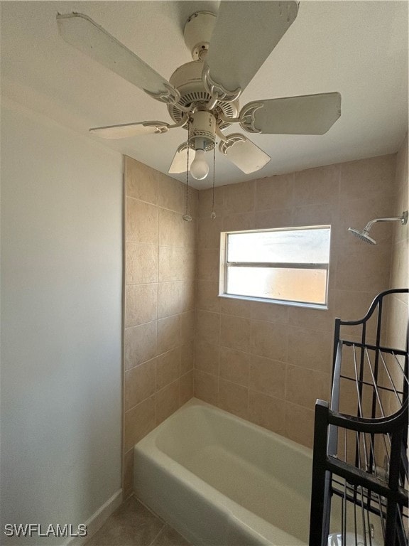 bathroom featuring tiled shower / bath combo, ceiling fan, and tile patterned floors