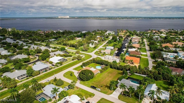 birds eye view of property with a water view