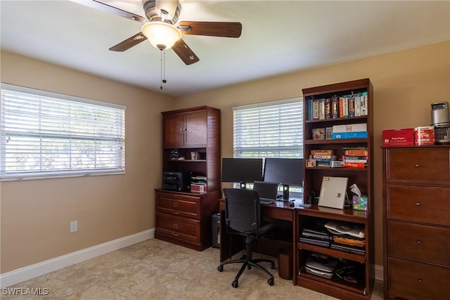 office space featuring ceiling fan and a healthy amount of sunlight