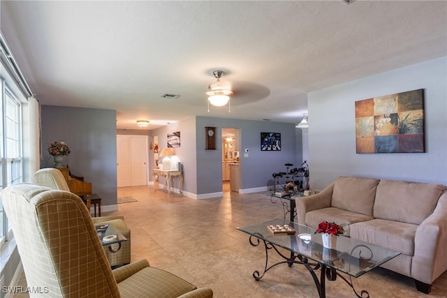 living room featuring ceiling fan