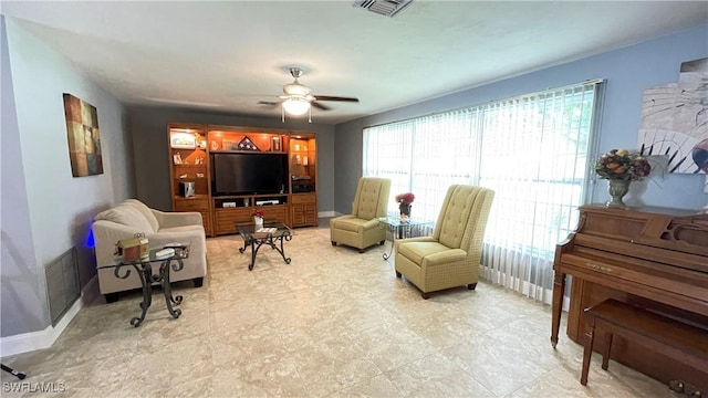 living area with ceiling fan