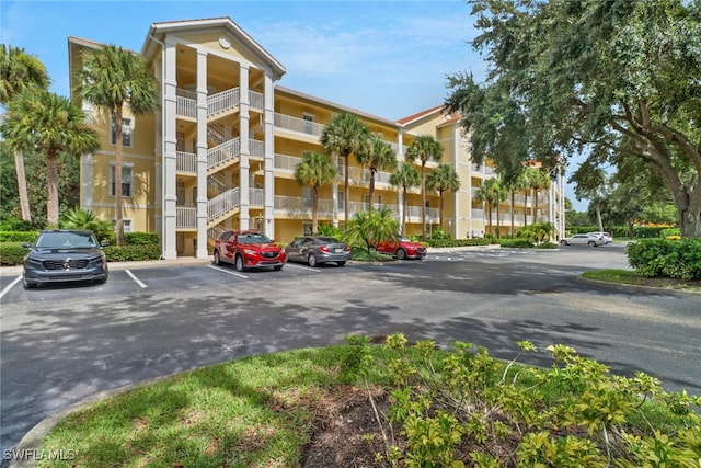 view of property featuring uncovered parking