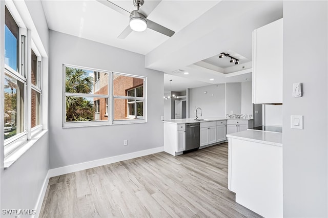 kitchen with dishwasher, white cabinets, a healthy amount of sunlight, and light hardwood / wood-style floors