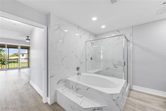 bathroom with hardwood / wood-style flooring, independent shower and bath, and ceiling fan