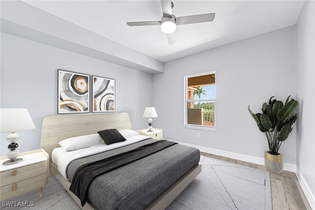 bedroom with hardwood / wood-style flooring and ceiling fan