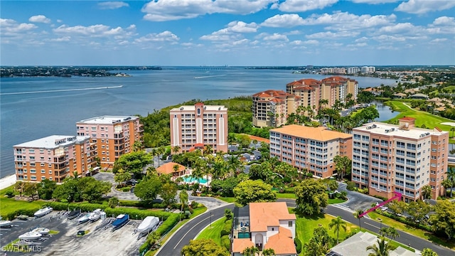 birds eye view of property with a water view