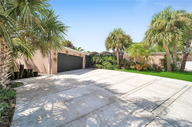 view of side of home with a garage