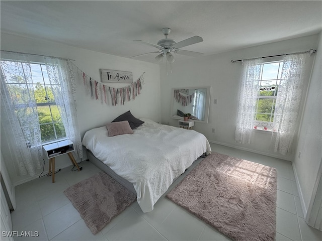 bedroom with light tile patterned floors and ceiling fan