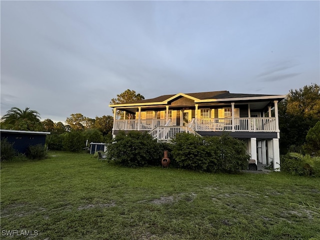 rear view of property with a yard