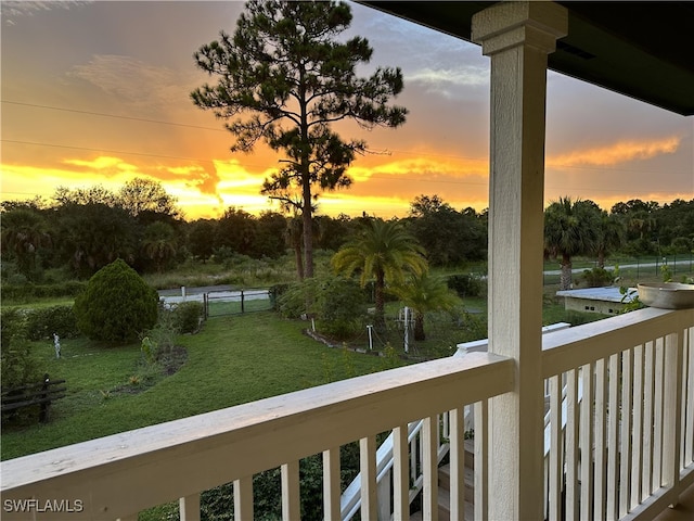 view of balcony at dusk