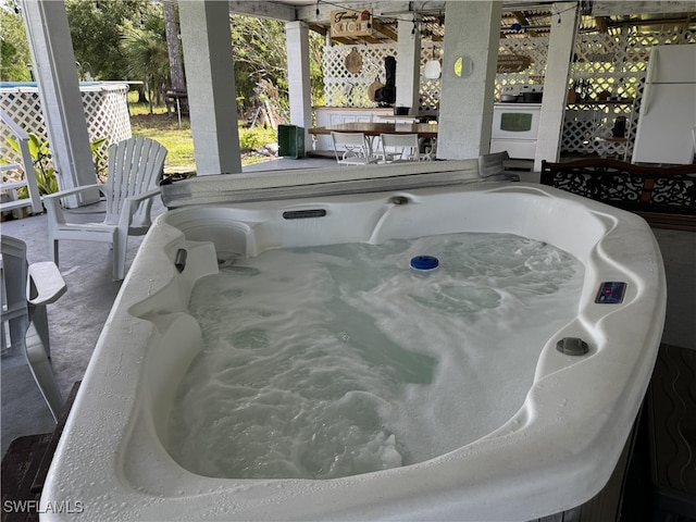 details with white appliances and a jacuzzi