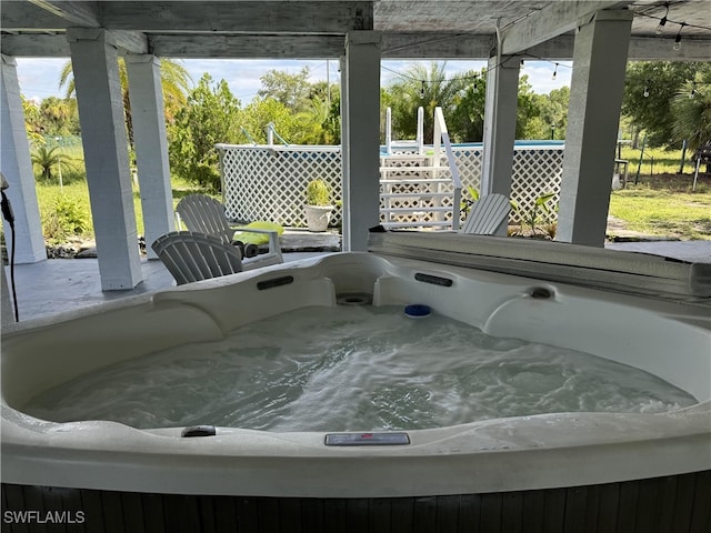 sunroom with a jacuzzi