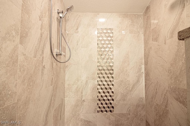 1201 SW 13th St, Cape Coral, FL 33991 - interior details featuring tiled shower and a textured ceiling