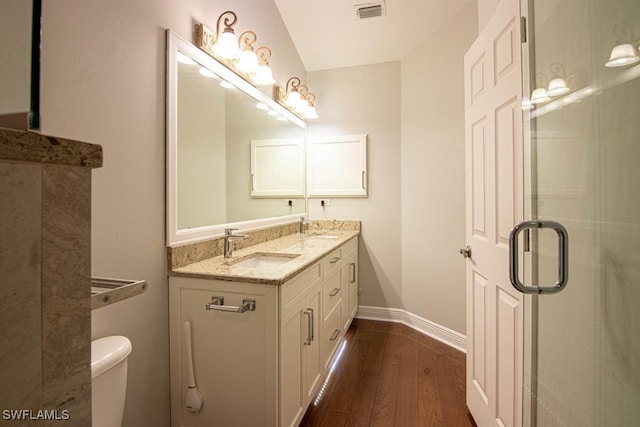 1201 SW 13th St, Cape Coral, FL 33991 - full bath featuring toilet, baseboards, a sink, double vanity, and wood finished floors