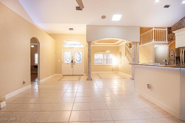 1201 SW 13th St, Cape Coral, FL 33991 - foyer with ornate columns, light tile patterned floors, arched walkways, and visible vents
