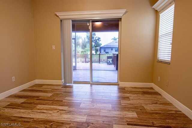 spare room with light wood-type flooring