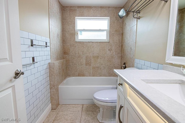 1201 SW 13th St, Cape Coral, FL 33991 - bathroom featuring toilet, vanity,  shower combination, tile patterned flooring, and tile walls