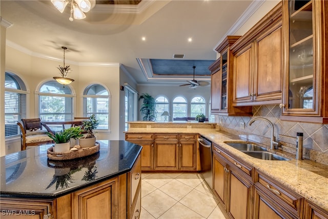 kitchen with ceiling fan, ornamental molding, decorative light fixtures, and kitchen peninsula