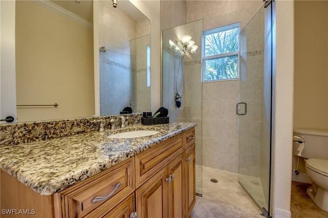 bathroom featuring a stall shower, toilet, ornamental molding, tile patterned flooring, and vanity