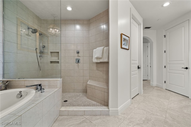 bathroom with baseboards, visible vents, a walk in shower, a bath, and recessed lighting