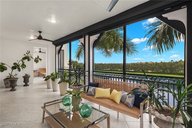 sunroom featuring ceiling fan