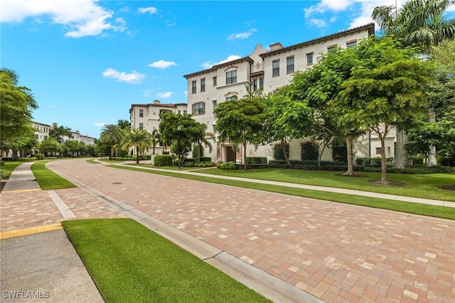 view of home's community featuring a lawn