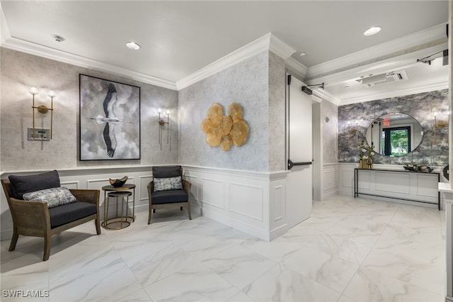 sitting room featuring ornamental molding, marble finish floor, a wainscoted wall, and a decorative wall