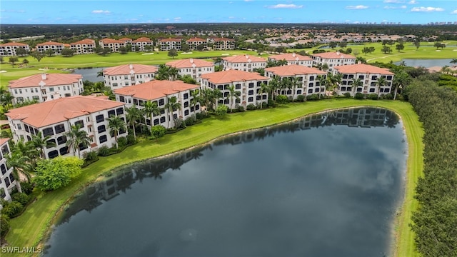 bird's eye view featuring a residential view and a water view