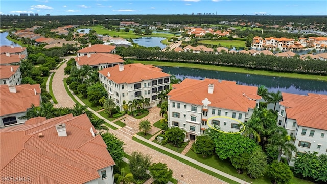 birds eye view of property with a water view