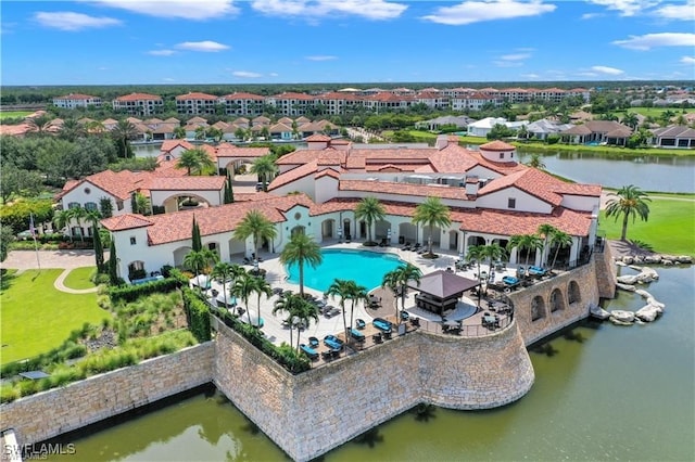 aerial view with a water view and a residential view