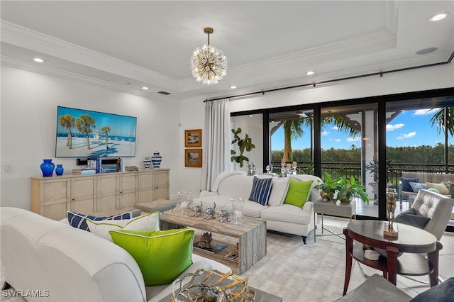 living room featuring a chandelier, ornamental molding, a raised ceiling, and recessed lighting