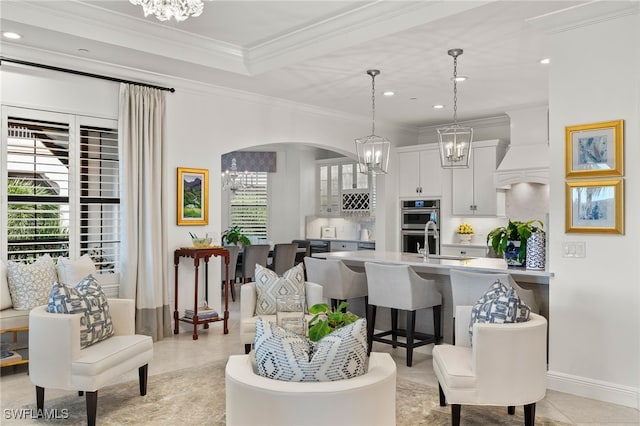 living room featuring plenty of natural light and ornamental molding