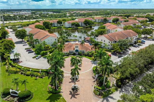 aerial view with a residential view and a water view