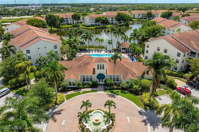 aerial view featuring a water view and a residential view