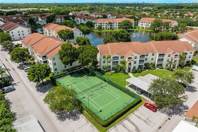 aerial view featuring a residential view and a water view