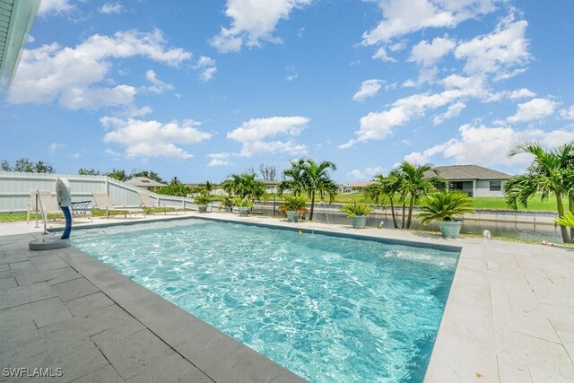 view of pool featuring a patio