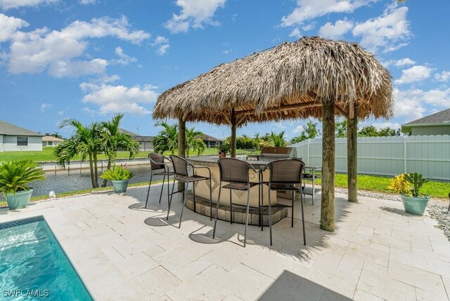 view of patio / terrace with a fenced in pool