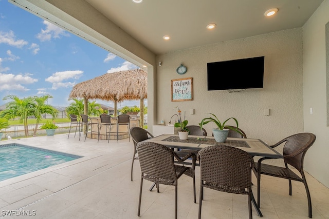 view of patio with an outdoor bar