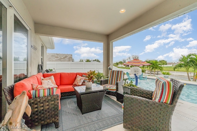 view of patio / terrace with a fenced in pool and an outdoor living space