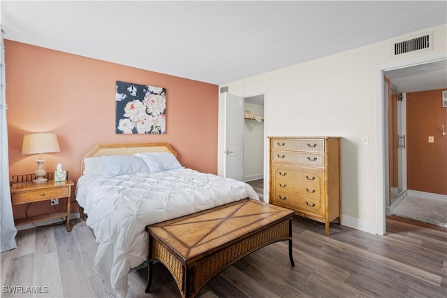 bedroom featuring hardwood / wood-style floors