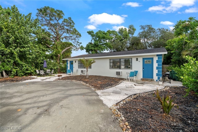 single story home featuring a patio