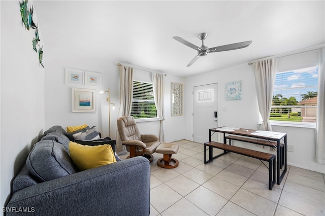 living room with ceiling fan and light tile patterned floors