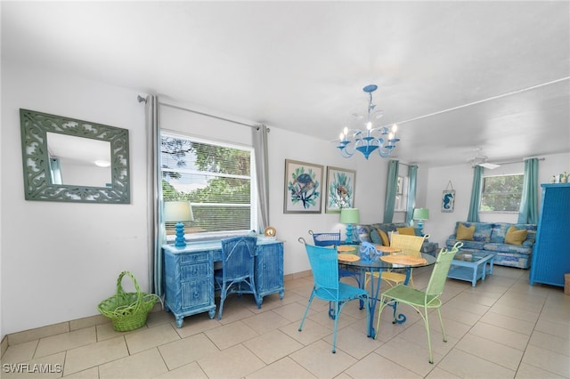 dining room featuring light tile patterned floors and a notable chandelier