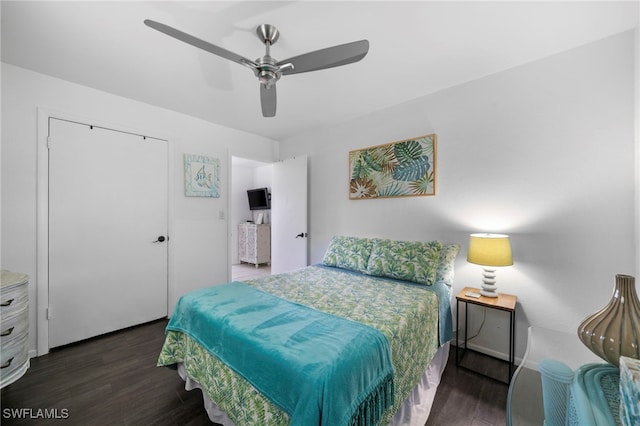 bedroom with ceiling fan and dark wood-type flooring